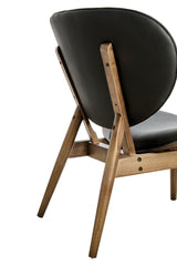 Stylish black leather effect chair featuring a curved backrest and a sturdy elm wood frame.