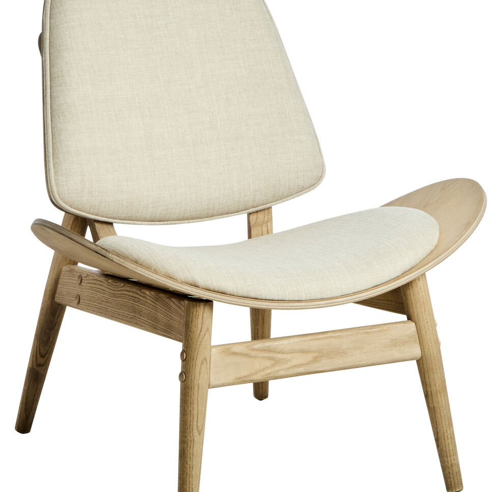 Beige fabric chair with a curved backrest and wide seat, featuring washed elm wood legs and armrests.