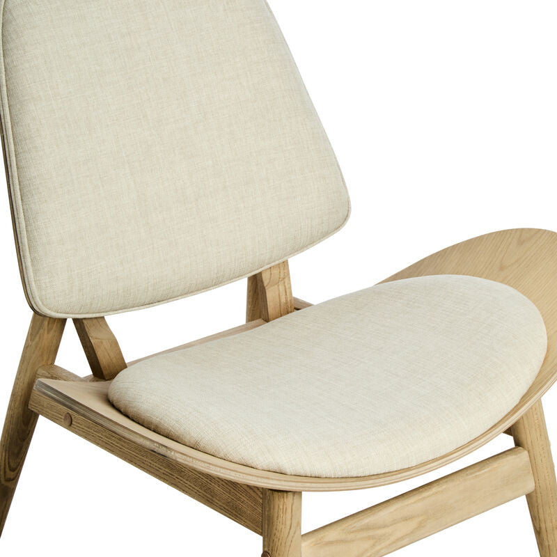 Beige fabric chair featuring a rounded backrest and a wide, cushioned seat, supported by natural washed elm wood legs.