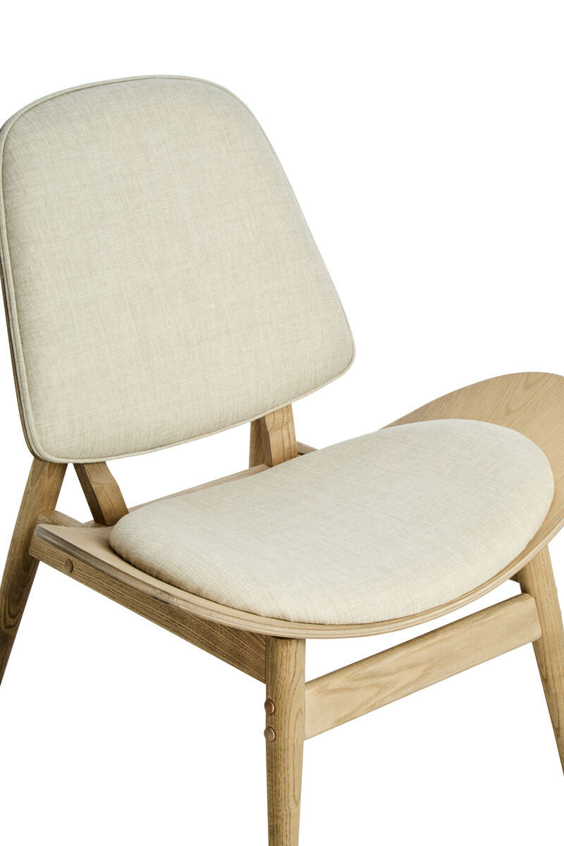 Beige fabric chair featuring a rounded backrest and a wide, cushioned seat, supported by natural washed elm wood legs.