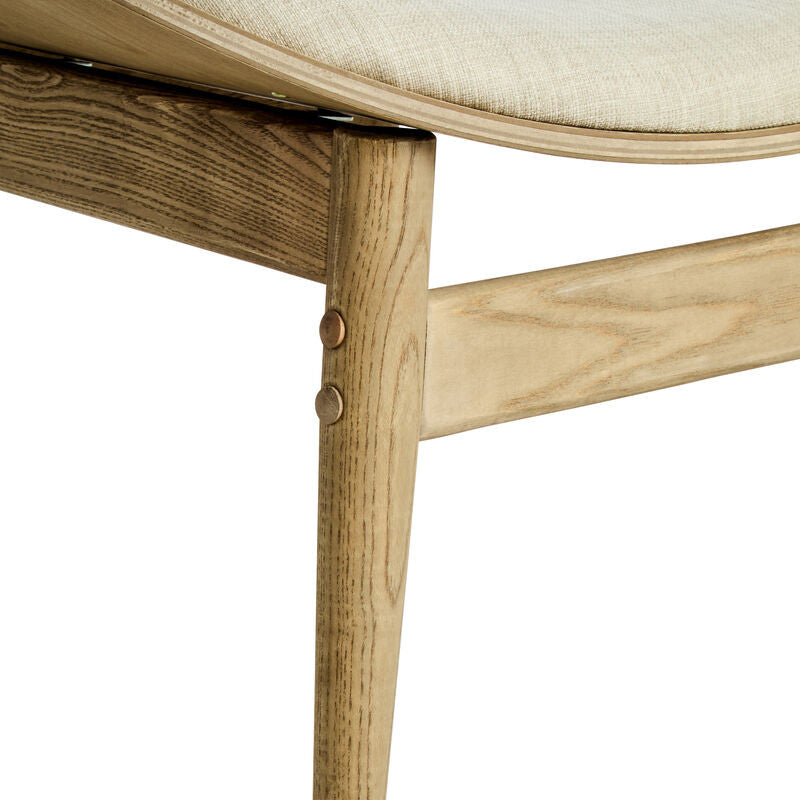 Beige fabric chair featuring a gently curved seat and backrest, supported by natural washed elm wood legs.