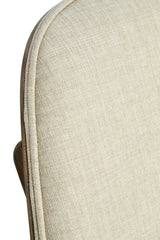 Beige fabric chair featuring a textured upholstery with a subtle weave pattern, complemented by a washed elm wood frame.