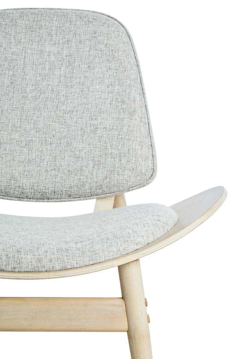 Grey fabric chair featuring a rounded backrest and a curved seat, supported by light washed elm wood legs.