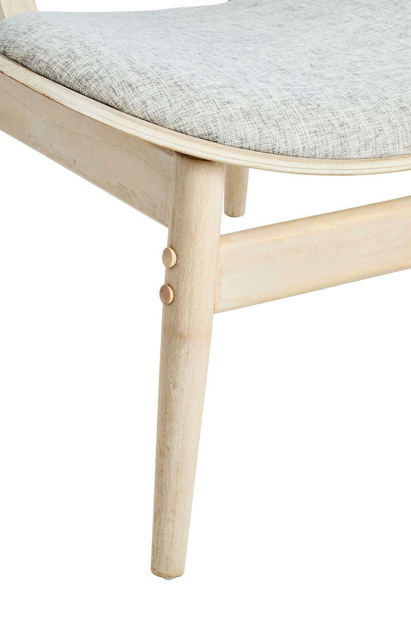 Grey fabric upholstered chair featuring a gently curved seat and washed elm wood legs.