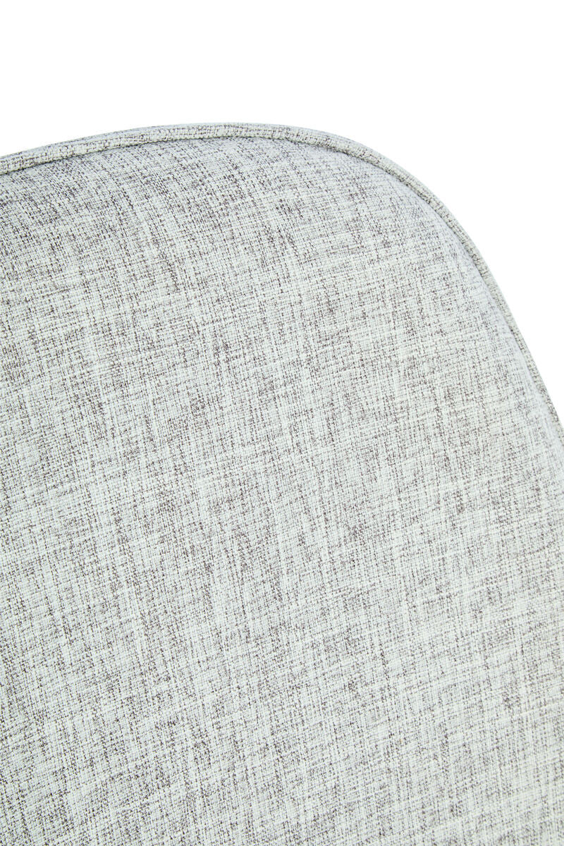 Close-up of the textured grey fabric upholstery of a chair, featuring a subtle woven pattern and rounded edges, highlighting the soft and inviting surface.