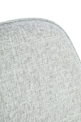 Close-up of the textured grey fabric upholstery of a chair, featuring a subtle woven pattern and rounded edges, highlighting the soft and inviting surface.