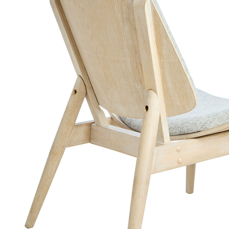 Grey fabric chair featuring a washed elm wood frame, showcasing a smooth, curved backrest and tapered legs. The seat is cushioned for comfort, with a subtle texture in the fabric.