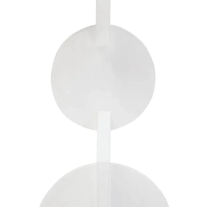 White round side table with modern geometric base design, viewed from the front