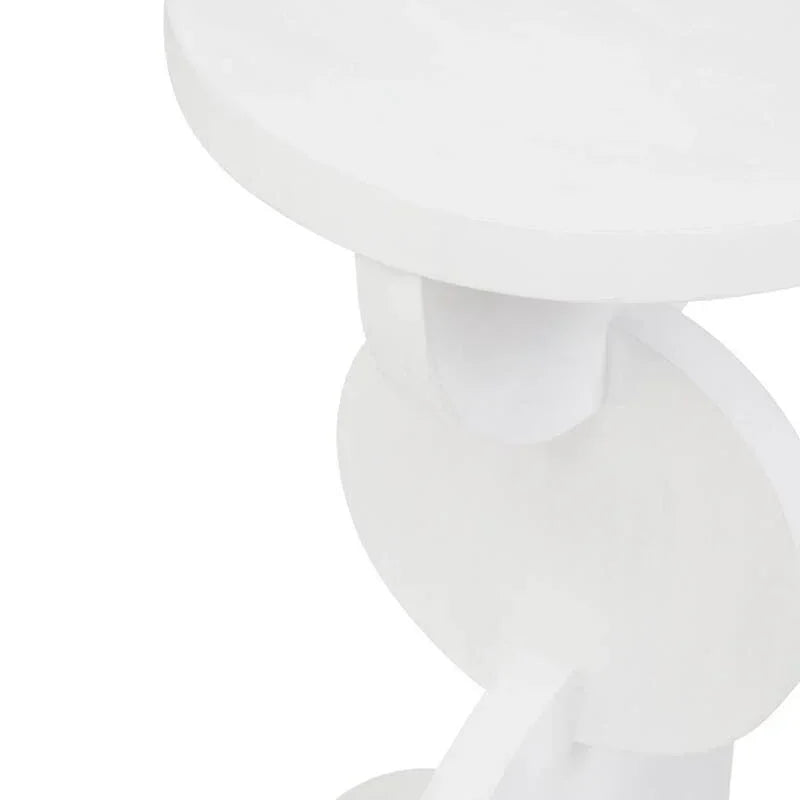 White wooden side table with circular top and geometric base, close up view