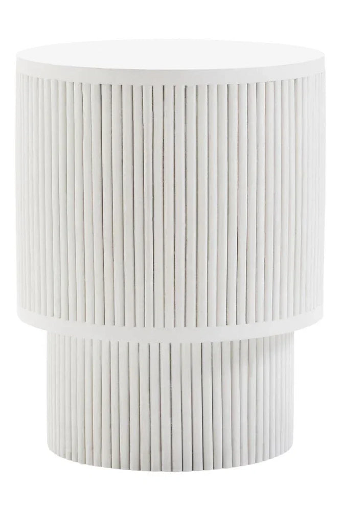 White round side table with vertical ribbed detail and textured finish