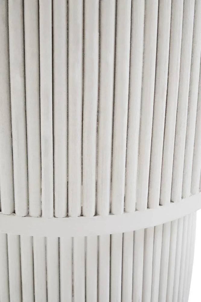 Close up of cream ribbed side table with vertical wooden slats