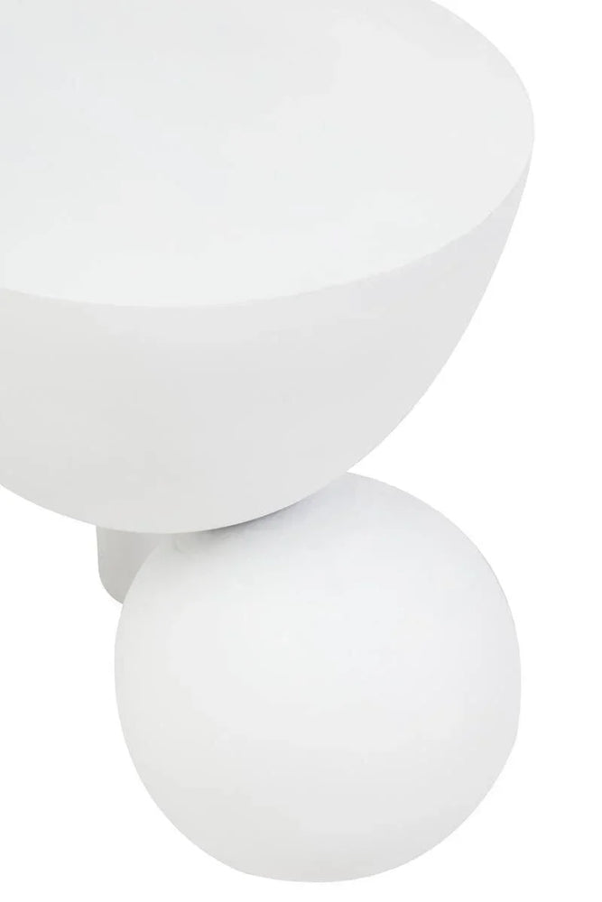 White modern side table with spherical base and smooth matte finish, close-up view