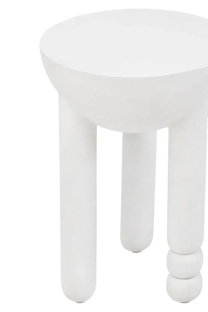 White round side table with three sculpted legs, one featuring stacked sphere detail