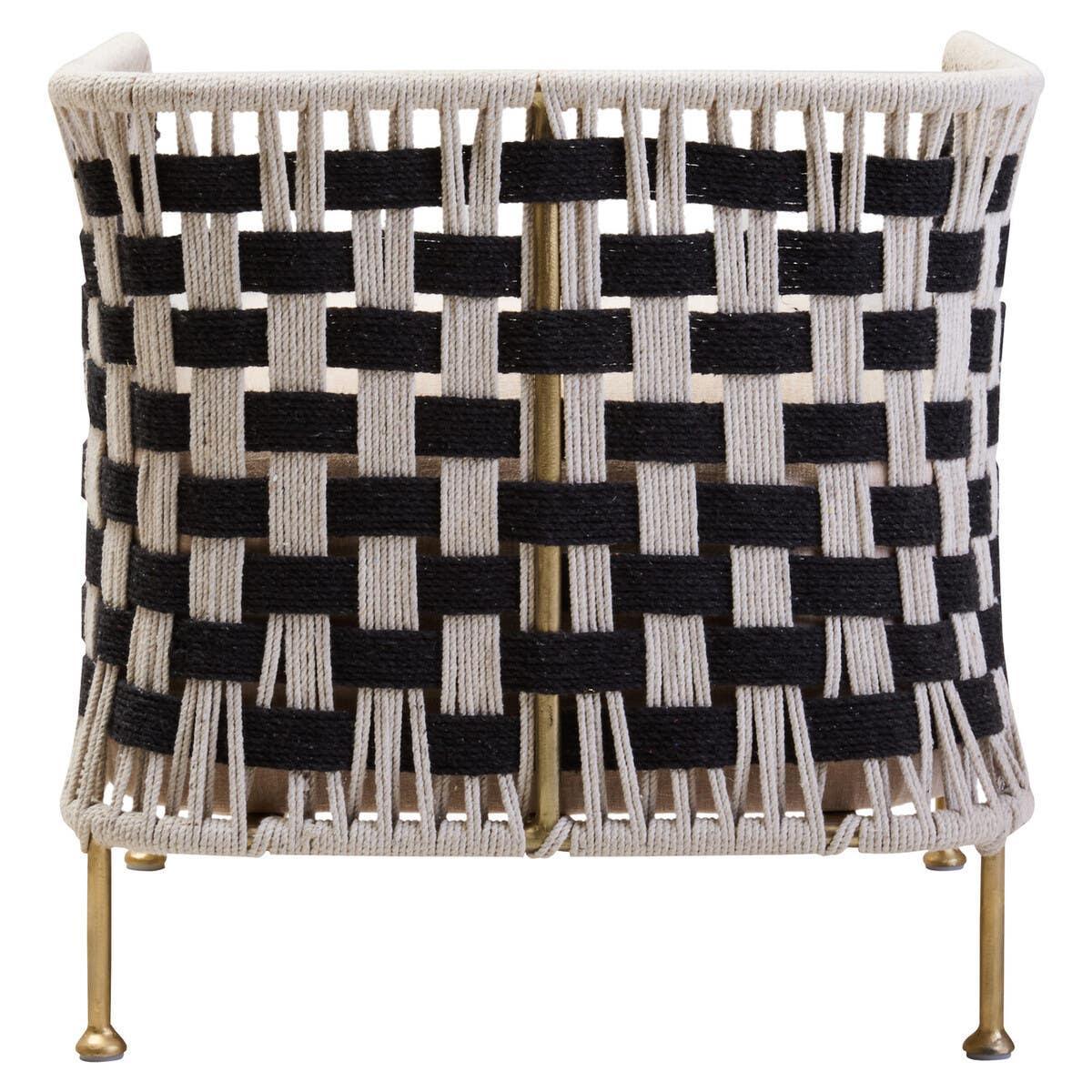 Woven lounge chair with black and cream rope and brass legs, rear view