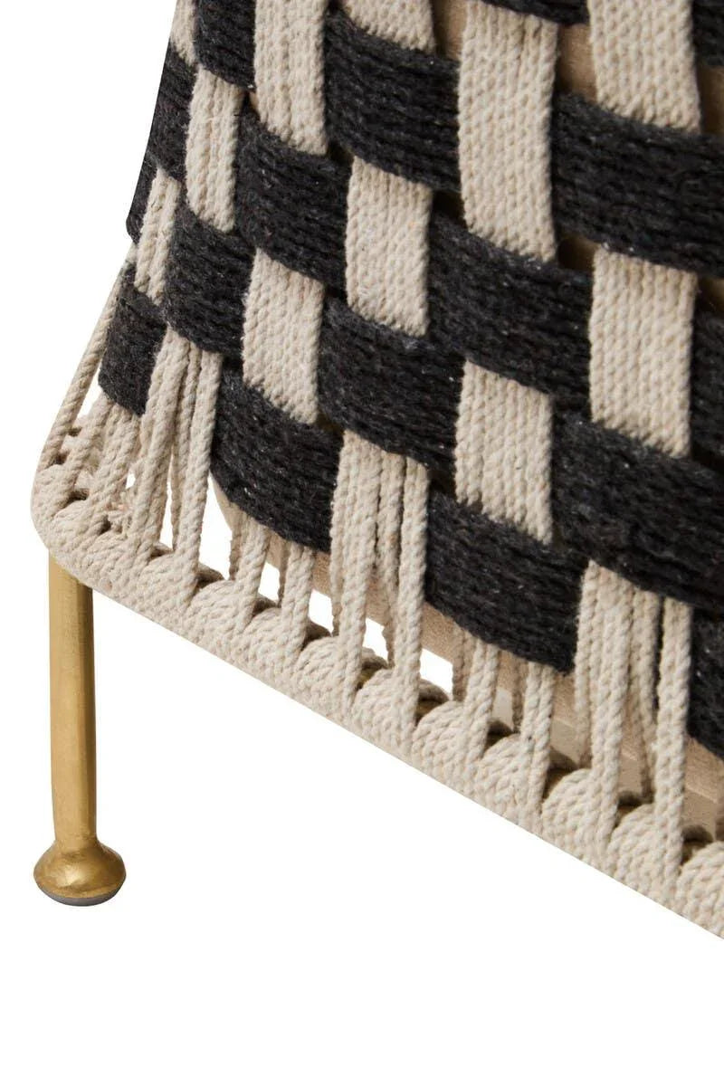 Black and natural woven rope furniture detail with gold metal leg