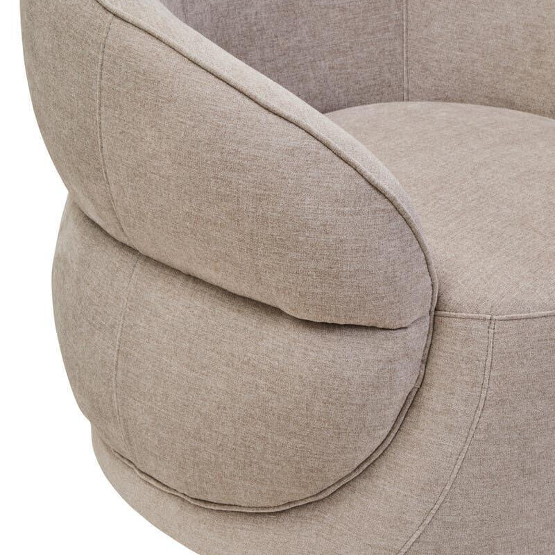 Close up of beige fabric armchair with rounded backrest and soft cushioned seat