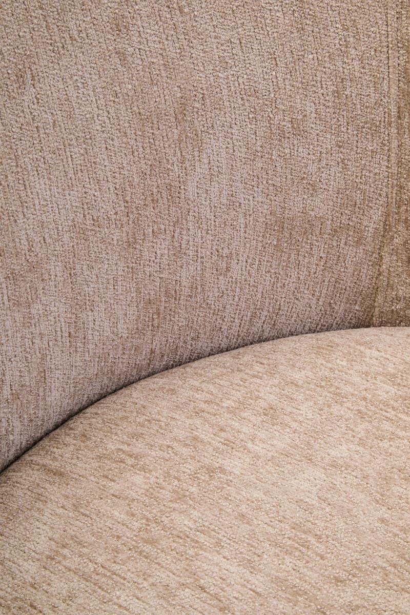Closeup of beige fabric sofa seat and curved backrest upholstery texture