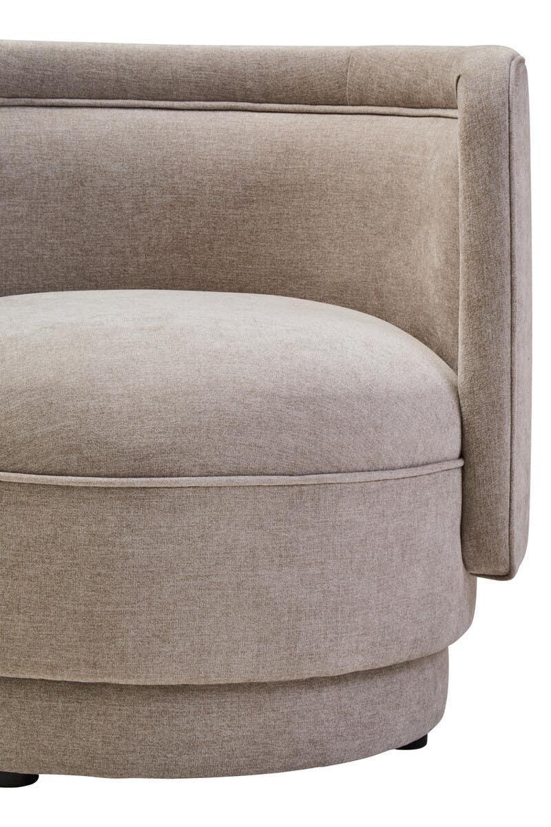 Beige fabric corner sofa with rounded cushion and modern upholstered backrest