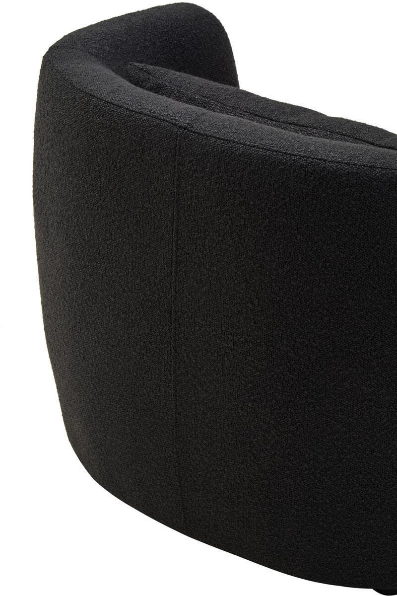 Curved black fabric sofa backrest with textured upholstery, close-up angle
