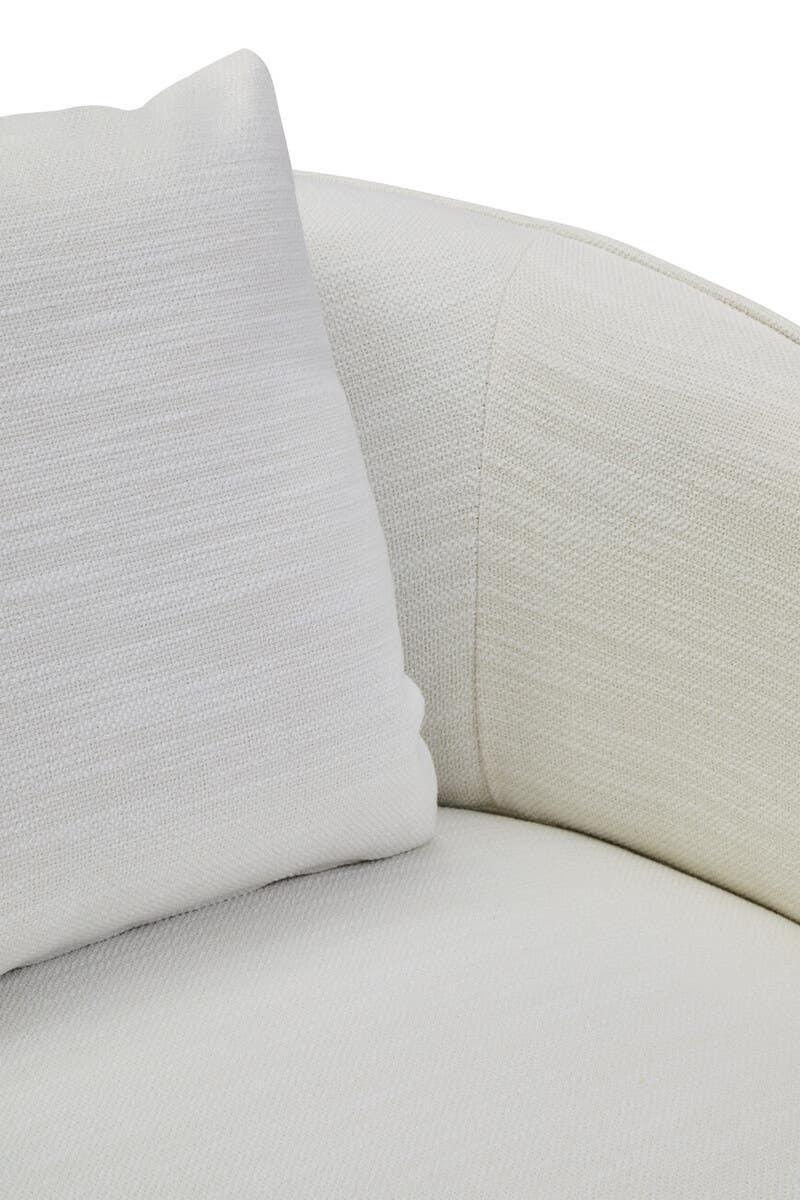 Close-up of cream fabric sofa cushion and armrest upholstery texture
