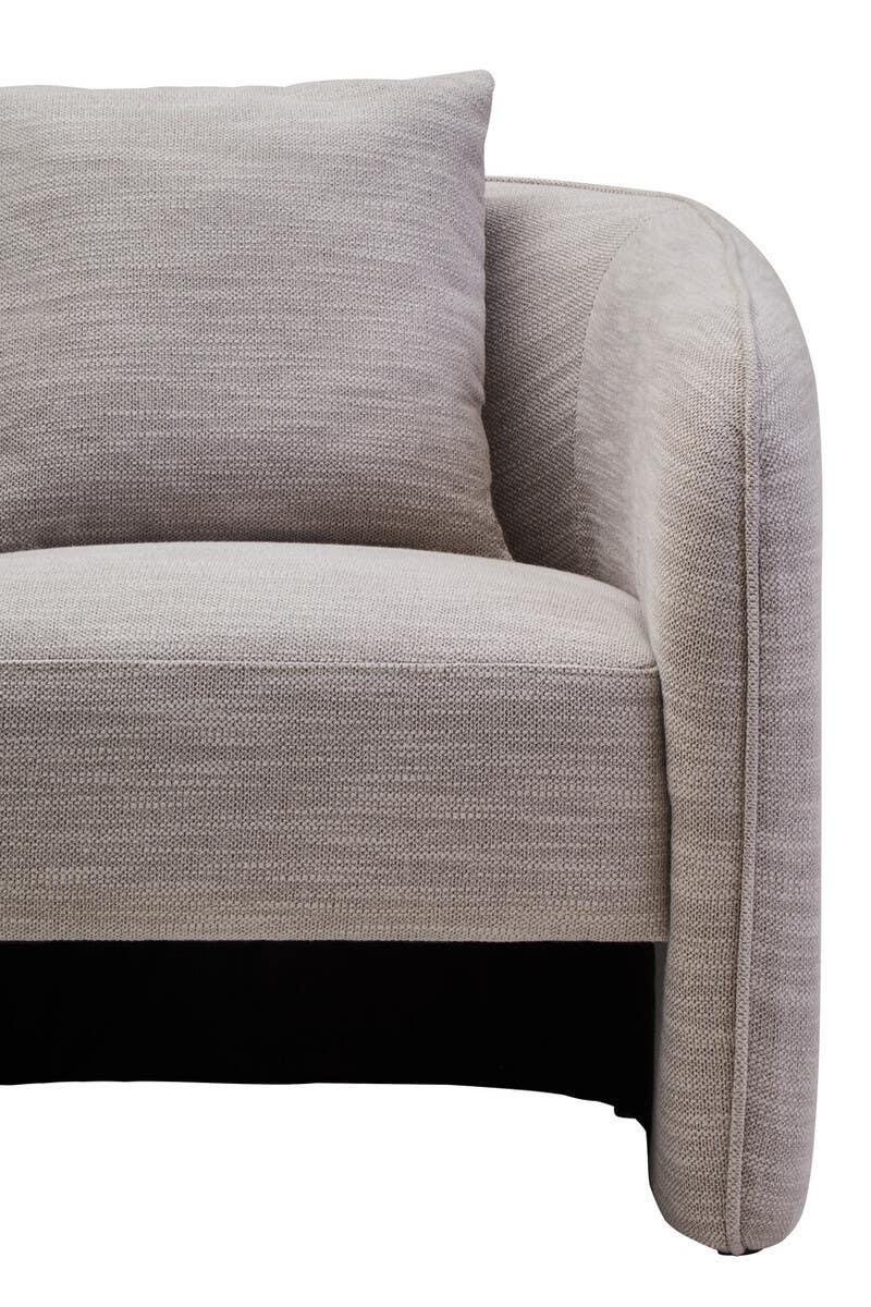 Light grey fabric sofa with curved armrest and matching cushion, close-up front view