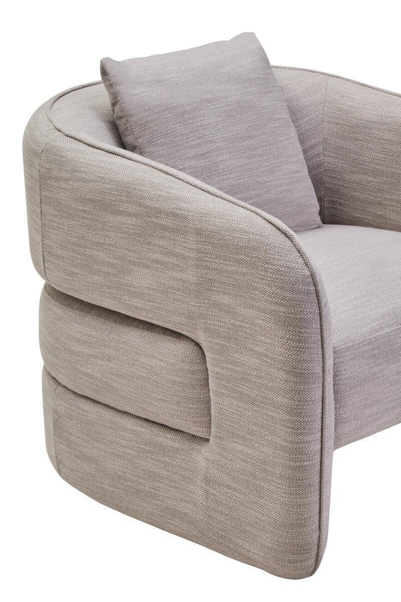 Light grey fabric armchair with rounded armrest and matching cushion, close-up side view