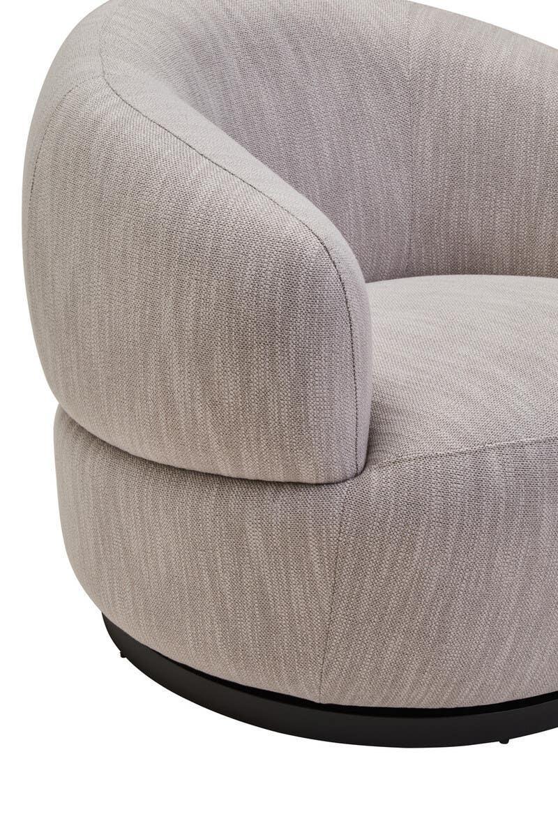 Neutral fabric swivel armchair with rounded design and black base, close-up view
