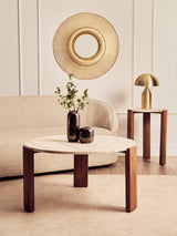 Round coffee table featuring a natural travertine marble top supported by sturdy acacia wood legs.