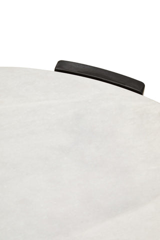 Round coffee table featuring a smooth white marble top with subtle veining, complemented by a sleek black wooden handle.