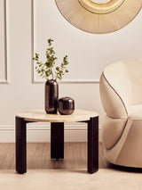 Round cream marble top coffee table with a sleek design, featuring a smooth surface and contrasting black legs.