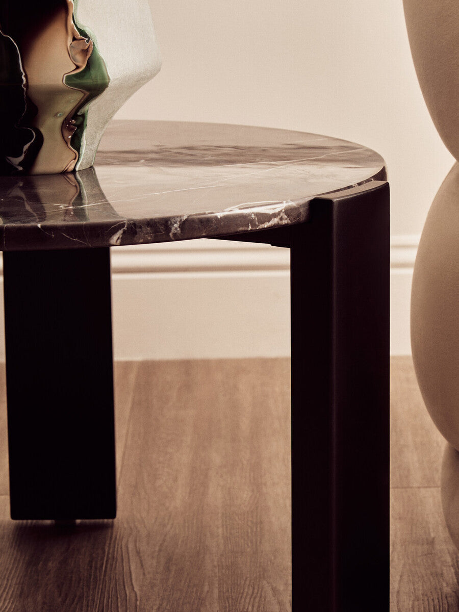 Round black marble top small coffee table featuring a sleek design with a polished surface and sturdy acacia wood legs.