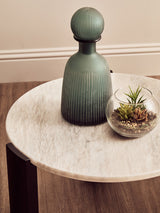Round white marble top small coffee table featuring a smooth surface with subtle veining, complemented by a dark acacia wood base.