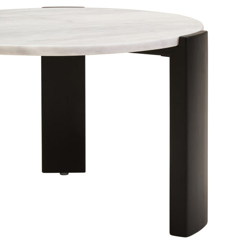 Round coffee table featuring a smooth white marble top and sleek black acacia wood legs.