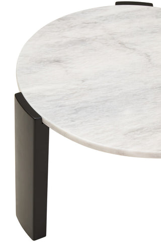 Round coffee table featuring a smooth white marble top with subtle gray veining, supported by sleek black acacia wood legs.