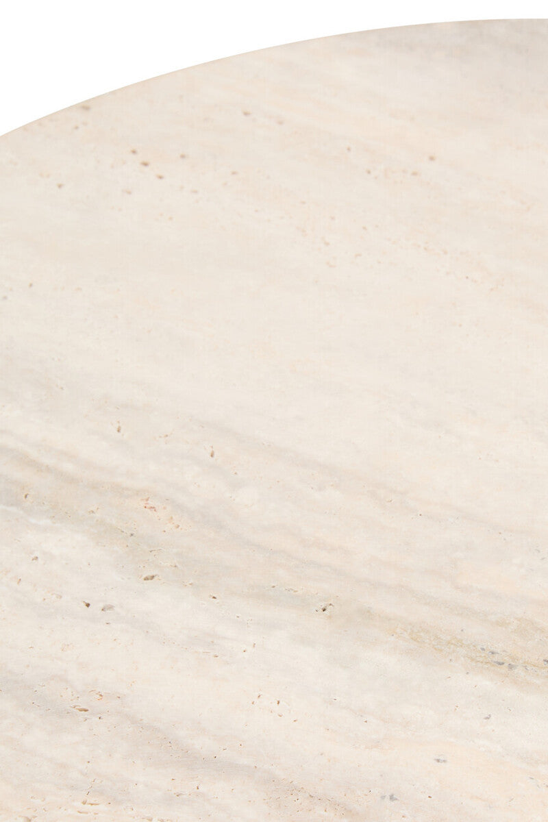 Round side table featuring a smooth travertine top with subtle beige and cream veining. The surface displays natural textures and small pockmarks typical of travertine stone.