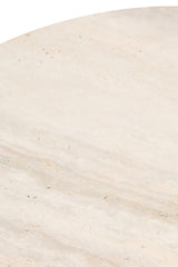 Round side table featuring a smooth travertine top with subtle beige and cream veining. The surface displays natural textures and small pockmarks typical of travertine stone.