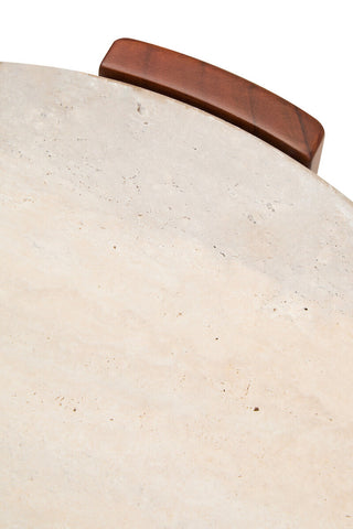 Round side table featuring a smooth travertine top with a natural stone finish, complemented by a rich brown acacia wood handle.