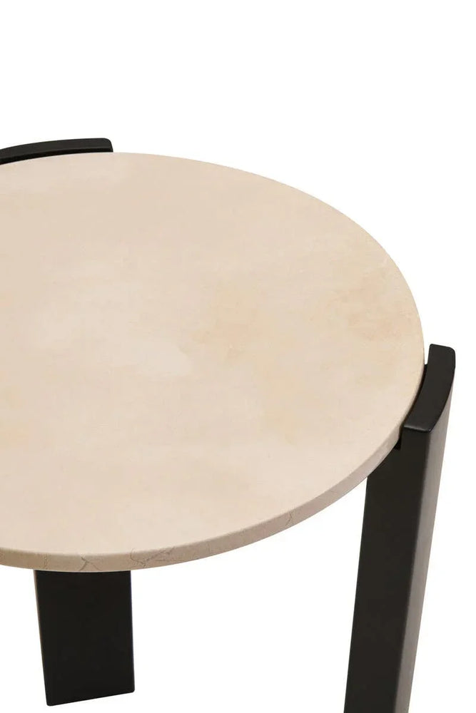 Round beige stone side table with black metal legs, top view