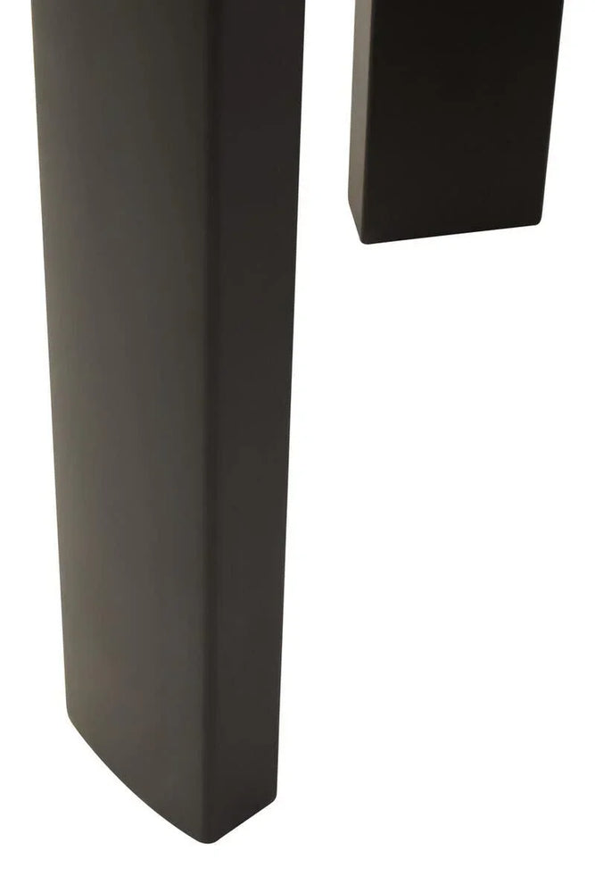 Closeup of dark wood furniture legs with square edges