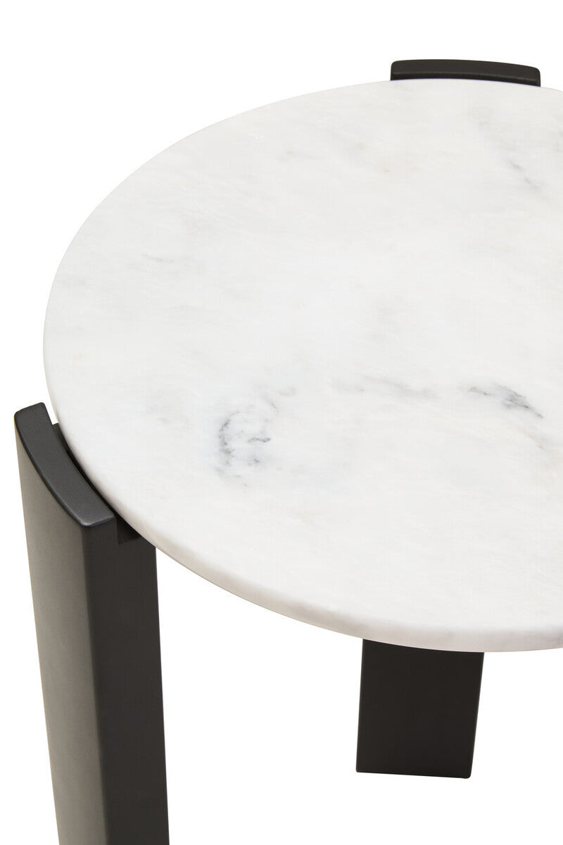 Round side table featuring a smooth white marble top with subtle gray veining, supported by sleek black acacia wood legs.