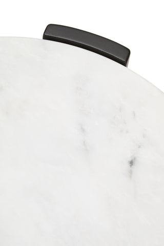 Round side table featuring a smooth white marble top with subtle gray veining, complemented by a sleek black handle.