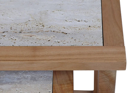 Closeup of travertine top coffee table with solid wood frame