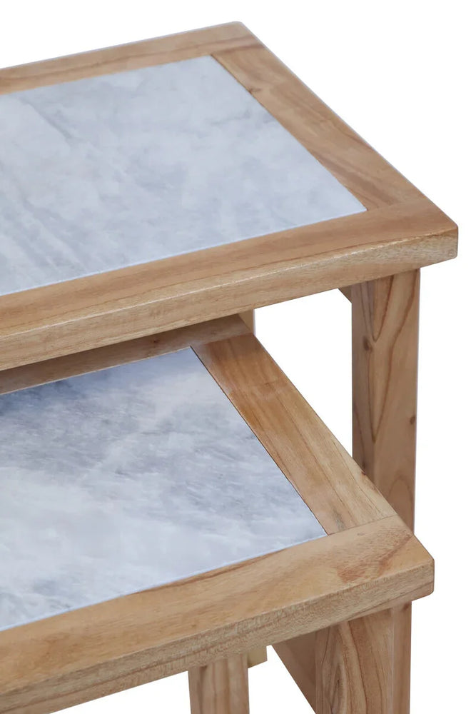 Stacked wooden nest tables with marble tops, close detail of surfaces and corners