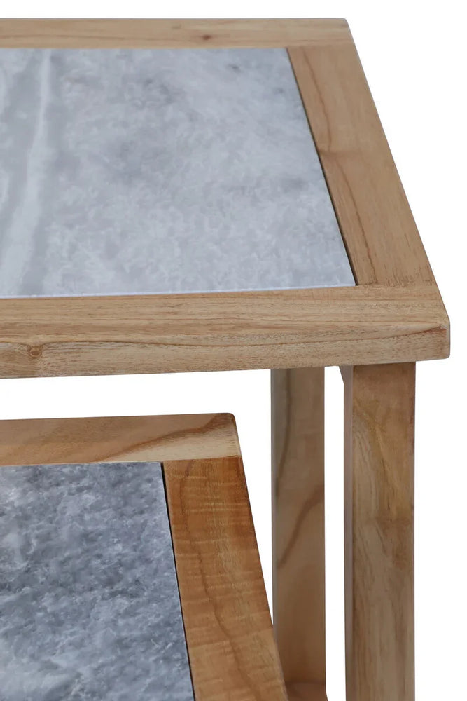 Close up of wooden side table with grey marble top and natural finish