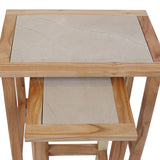 Nested side tables with light wood frame and beige marble tops, top down view