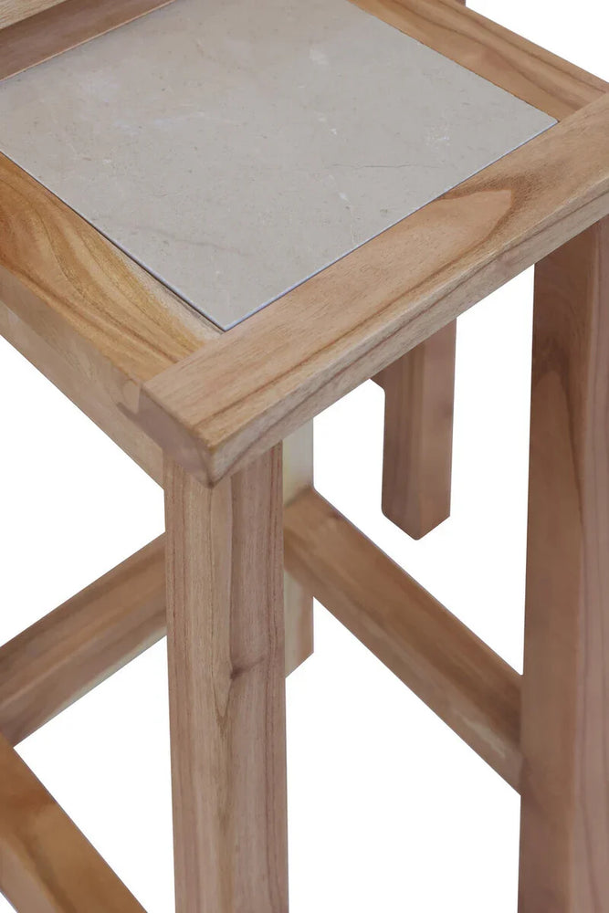 Close-up of wooden side table with square stone inlay top