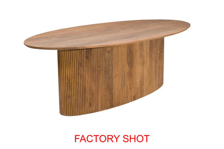 Oval wooden dining table with ribbed base and natural finish, factory shot on white background