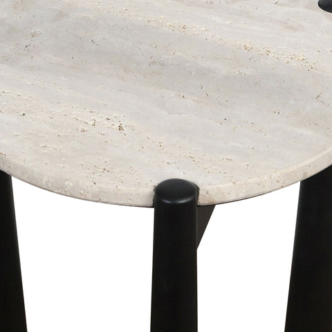 Round travertine top with a textured surface, supported by sleek black mango wood legs.