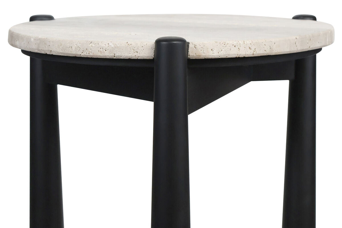 Round travertine top side table featuring a smooth, natural stone surface with subtle texture, supported by sleek black mango wood legs.