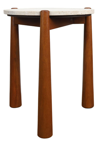 Round side table featuring a natural travertine top with a textured surface, supported by four sturdy, tapered brown mango wood legs.